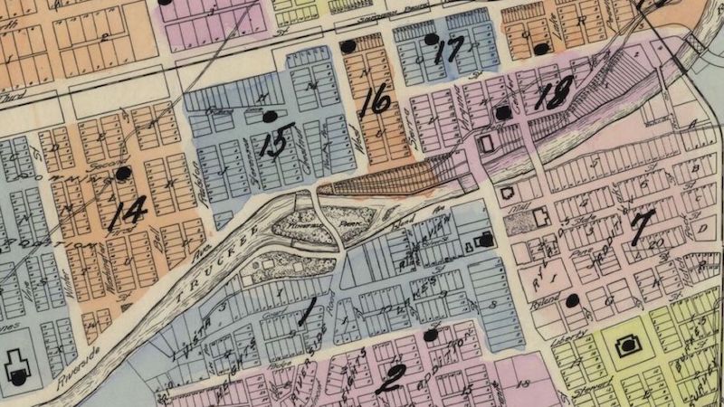 1927 map of Reno showing housing blocks in different colors, roads of the time, and the Truckee River.