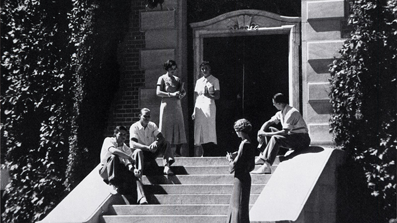 Students sit and stand on the steps at the Alice McManus Clark Library, 1936. Identifier: UNRA-P1384-1.
