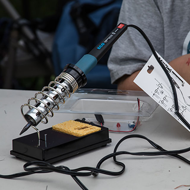 Soldering iron and a soldering project on a table
