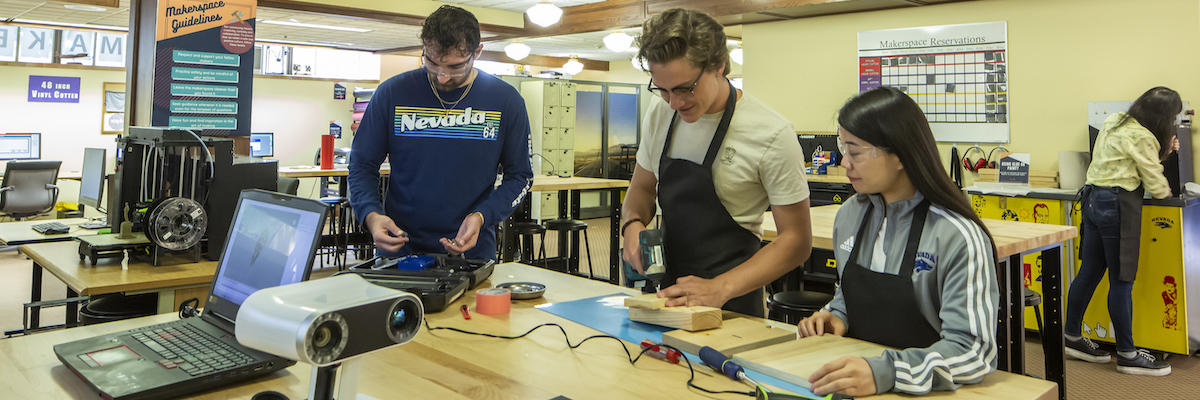 Team members carrying out training with hand tools in the Makerspace.