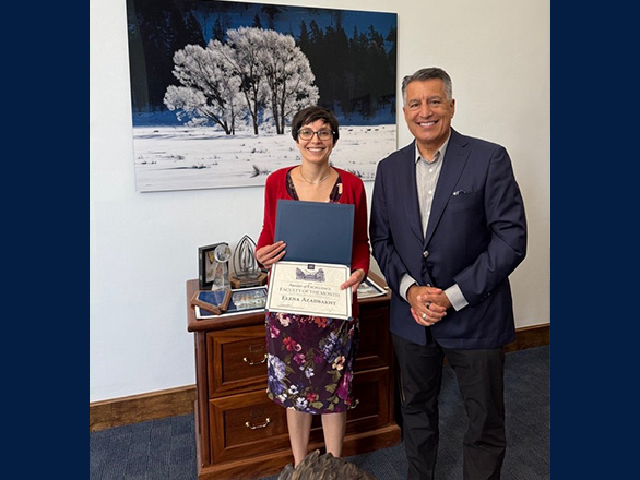 Elena Azadbakht stands with University president Brian Sandoval.