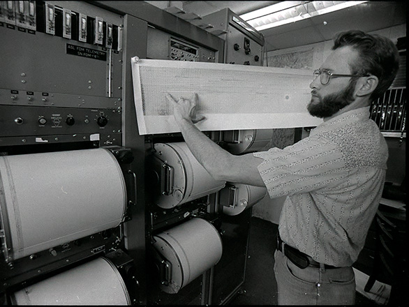 A man holds a long sheet of paper. Reno Newspapers, Inc., Reno Gazette-Journal Photographs, AC 1395, Special Collections and University Archives. Identifier: NC1395_005893-0006.
