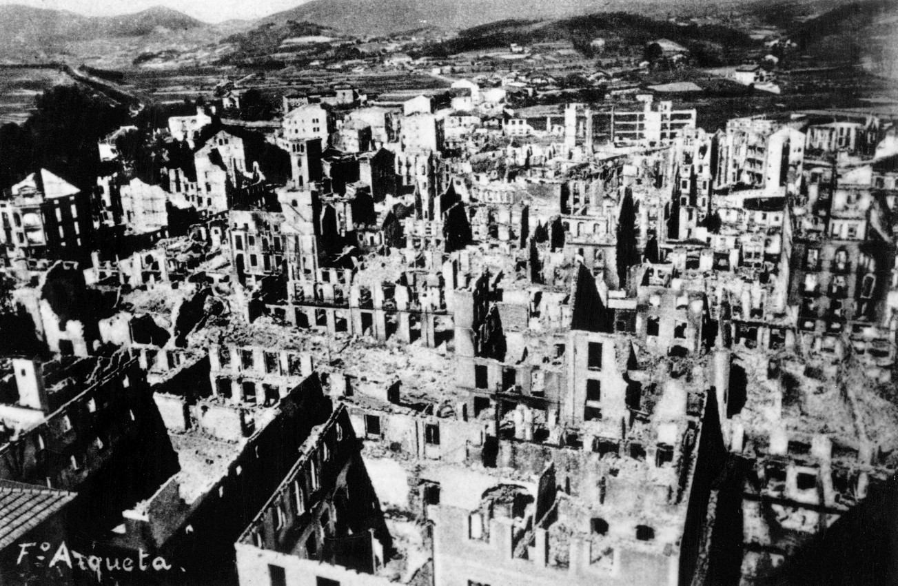Black and white photograph of the city of Gernika destroyed