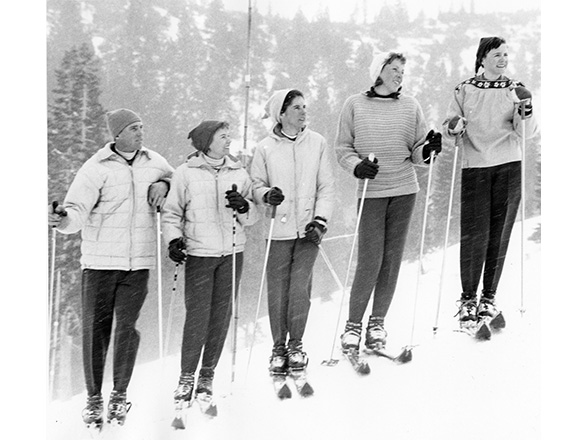 Five unidentified skiers pose together on the side of a snowy mountain, 1959. Campus Images Collection, UNRA-P1583-36. University Archives.