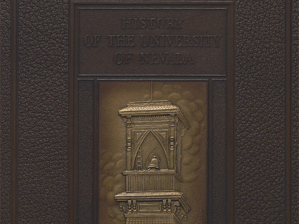 Embossed cover of An Illustrated History of the University of Nevada, showing to bell tower on the quad.