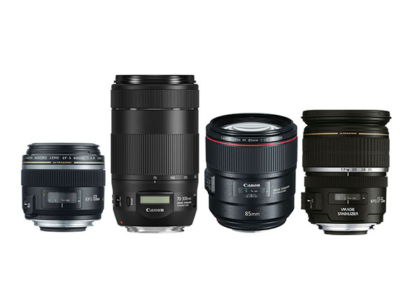 Assortment of four black lenses in a variety of sizes.