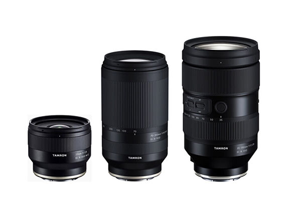 Three black Tamron lenses in a variety of sizes.
