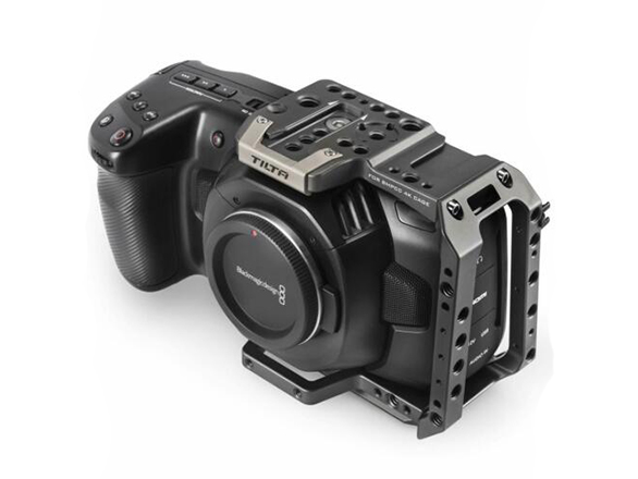 blackmagic 4k pocket cinema camera with capped lens, mounts for microphones and lights, and control buttons
