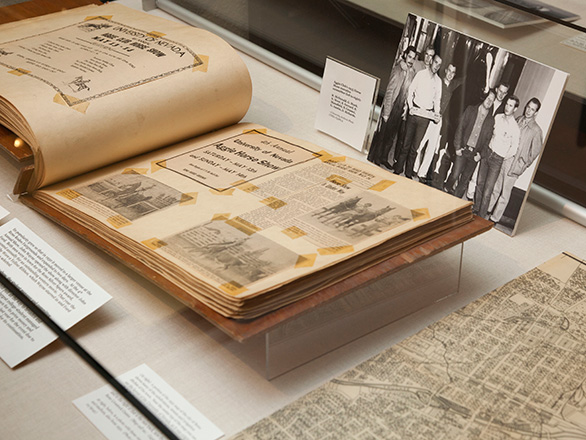 A close up image of a SCUA glass case with documents visible inside.