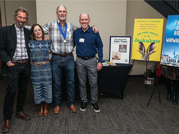 2024 Nevada Writers Hall of Fame program participants, Hall of Fame inductee and Silver Pen awardee stand for a group photo in advance of the post-induction book signing and reception.