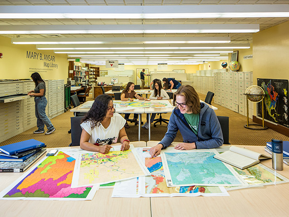 Students work in the DeLaMare Mary B. Ansari Map Library.