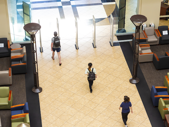 Students walking through the Knowledge Center atrium.