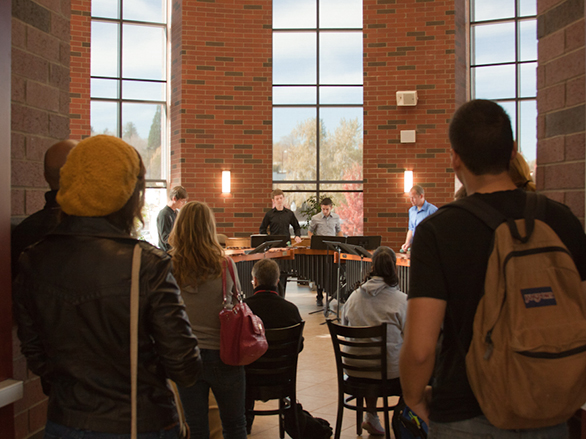 Students observing a concert in the KC rotunda