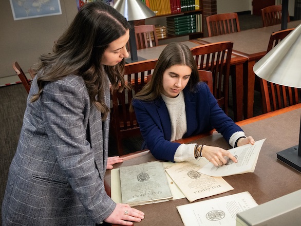 Interns working with materials in the Basque library