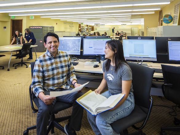 Data Services team member working with a student in the GIS Depot.
