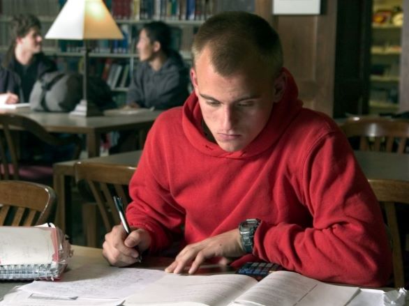 Student working with materials in the Libraries.