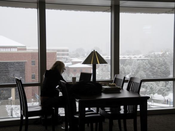 Student working with a laptop in the Knowledge Center