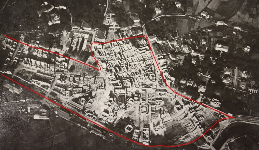 Aerial view of Gernika after the bombing which shows large area destroyed highlighted in red