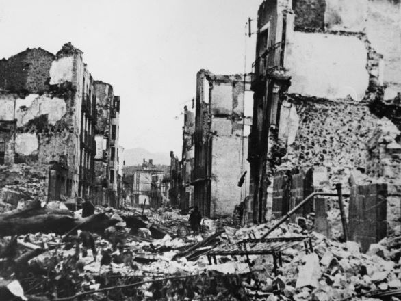 Closeup of a destroyed street in Gernika with exploded buildings on both sides