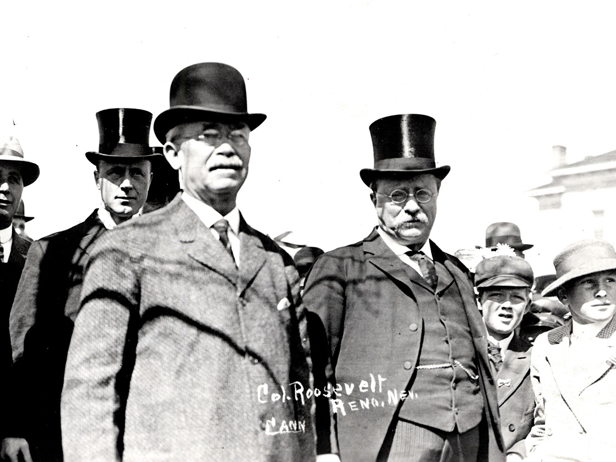 Joseph E. Stubbs, President of the University of Nevada (president from 1894-1914) stands to the left of U.S. President Theodore Roosevelt with other unidentified men and children next to them.