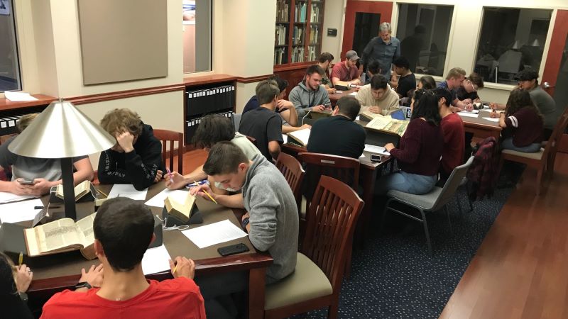 Students and faculty working with primary source materials in the Special Collections reading room.