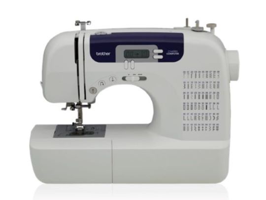 Brother sewing machine in white with buttons and toggle switches
