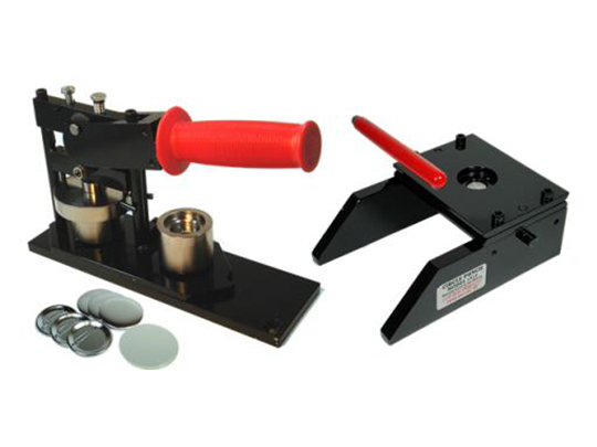 Black button maker with red lever handle and button blanks on white background