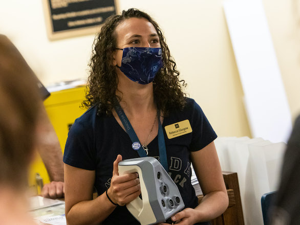 DeLaMare staff member wearing a mask in the Makerspace.
