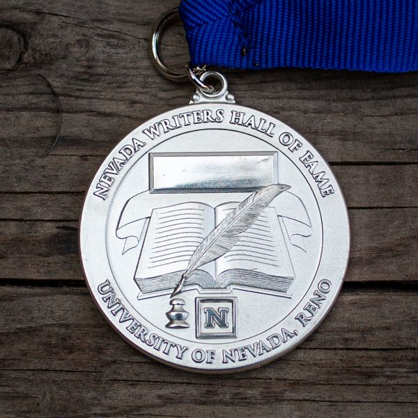 Silver medal on blue ribbon from the Nevada Writers Hall of Fame.