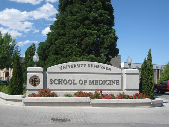 The University of Nevada, Reno School of Medicine sign with trees in the background