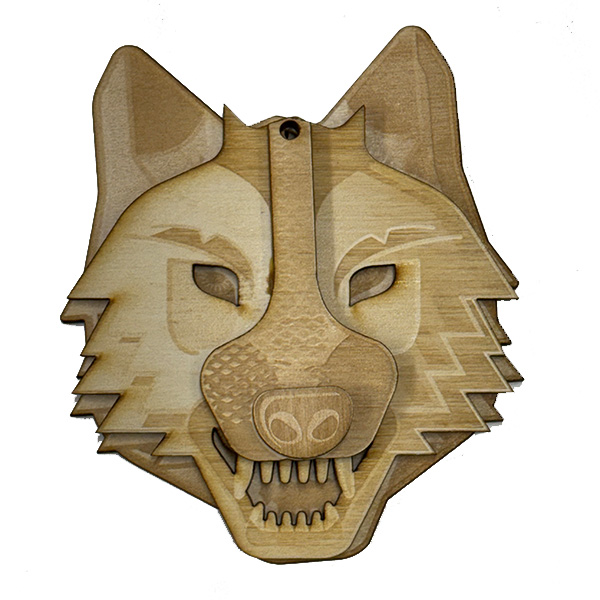 Wooden wolf face ornament.