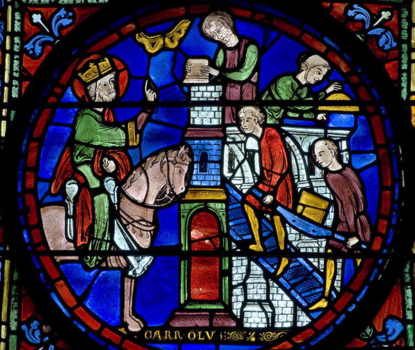 A vibrant stained glass window showing a man on horseback speaking to other men building a structure.