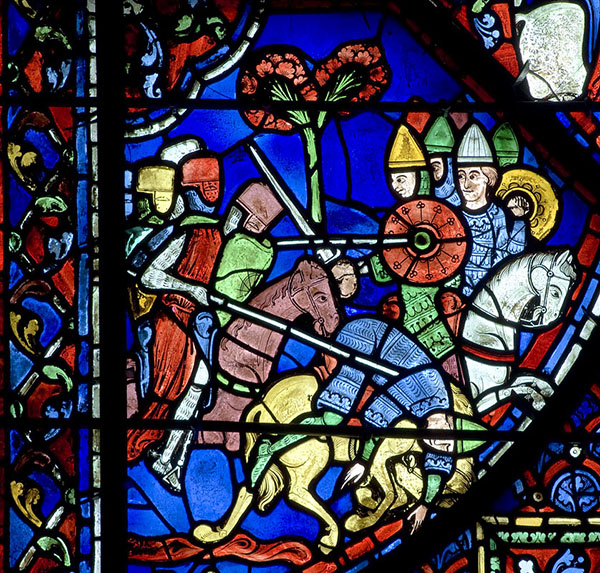 A vibrant stained glass window depicting war on horseback.