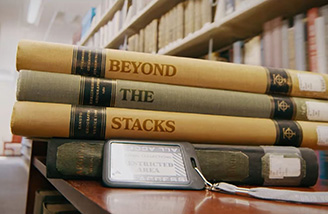 Intro image of Beyond the Stacks, showing books stacked on a cart with the words "Beyond the Stacks".