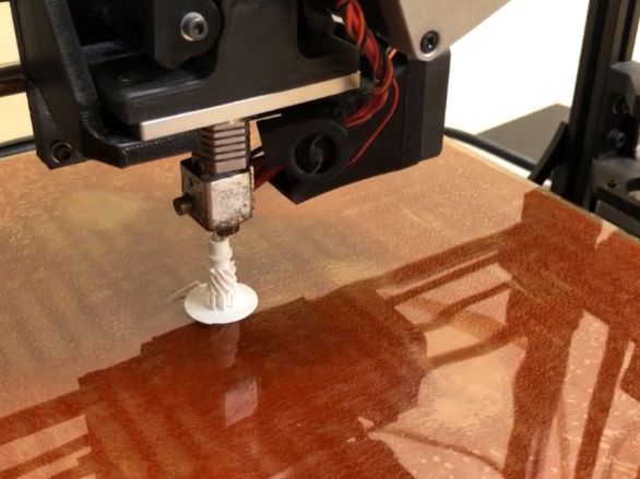 Closeup photo of a 3D printer working on a project